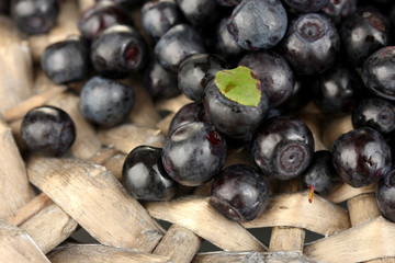 Fresh blueberries on wicker mat close-up