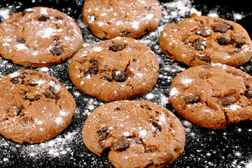 Chocolate chips cookies isolated on black