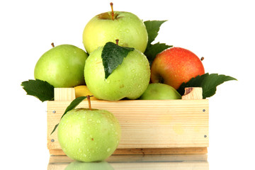 sweet apples in wooden crate, isolated on white