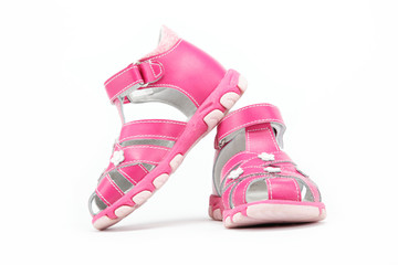 pink child's sandals isolated on white