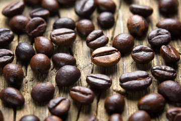 Coffee beans on the vintage wooden table