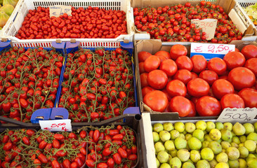 Colorful market stall with tomatoes and figs
