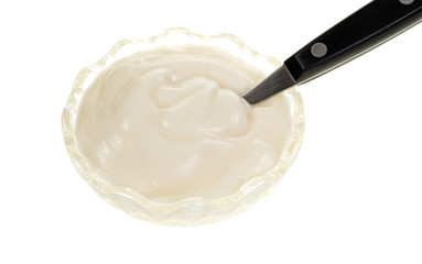 Small dish vanilla yogurt with spoon