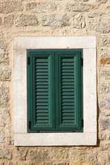 Fototapeta na wymiar Green window on the wall