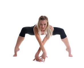 Fototapeta na wymiar young blond woman stand in spider yoga pose