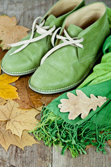 green leather boots, scarf and yellow leaves