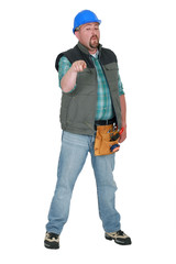 A plumb handyman pointing at the camera.