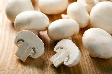 Champignon on wooden background