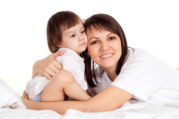 A good Caucasian mother with her daughter lying