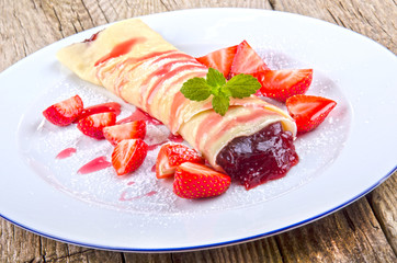 crepe with strawberries and jam