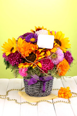 Beautiful bouquet of bright flowers with paper note