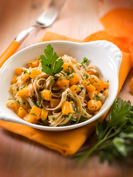 tagliatelle with pumpkins and parsley, selective focus