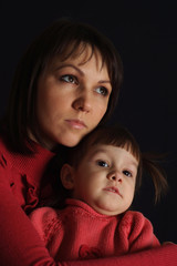 Pretty sad Caucasian woman with a daughter