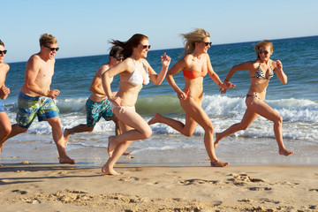 Group Of Teenage Friends Enjoying Beach Holiday Together