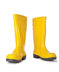 Yellow rubber boots isolated on white