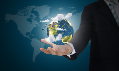 Hand of business man holding earth globe