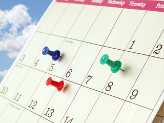 Closeup of Calendar Page with Marked Important Days