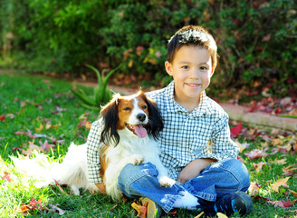 A Young Boy and a Dog