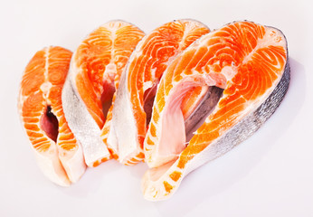  Four raw salmon steaks