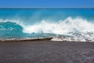 Canary Islands brown sand beach rough turquoise waves