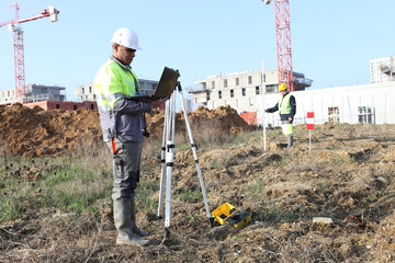 Surveyor on site with a laptop