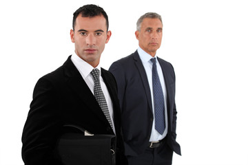 two businessmen posing