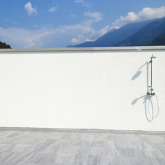 large terrace of a modern white house, shower
