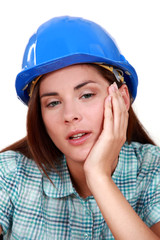 A tired-looking tradeswoman
