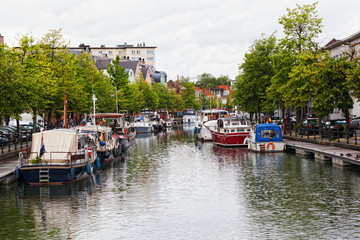 Urban view with  river and  yachts which are lying alongside