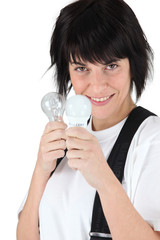 Woman with light bulbs in hands