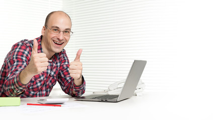 casual man working on a laptop computer
