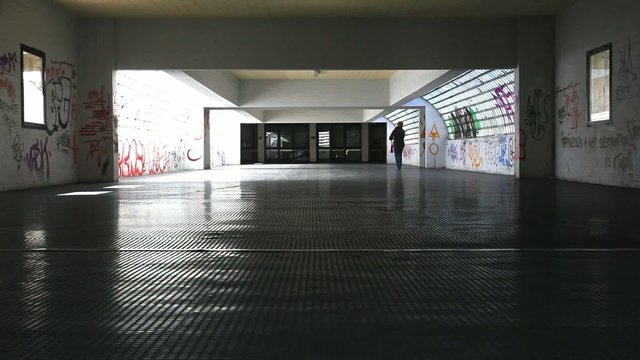A woman walking in the tunnel