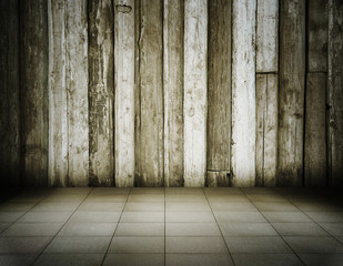 old room with wooden wall and tiled floor