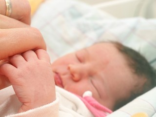 First touch between newborn and parent, in hospital