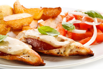 Grilled chicken breasts with cheese and baked potatoes