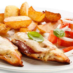 Grilled chicken breasts with cheese and baked potatoes