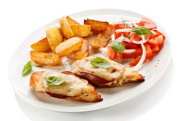 Fototapeta na wymiar Grilled chicken breasts with cheese and baked potatoes