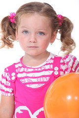 Little girl with orange balloon