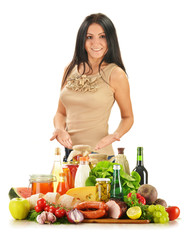 Young woman with variety of grocery products