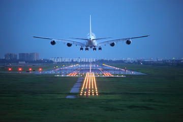 passenger plane fly up over take-off runway from airport - obrazy, fototapety, plakaty