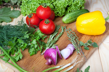 Fresh vegetables on cutting board.