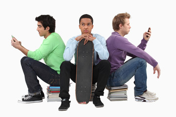 Annoyed young man waiting for his friends to finish texting