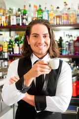 Barista in his cafe or coffeeshop