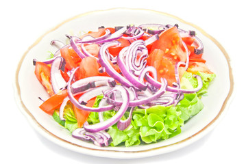 fresh salad in the plate on white
