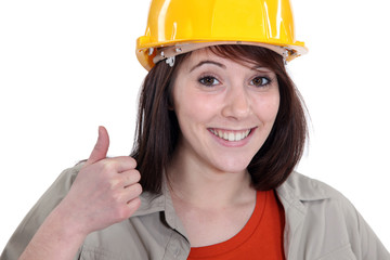 Female builder giving thumbs-up