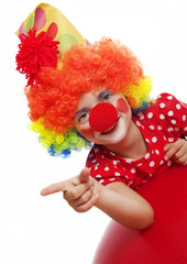 happy clown pointing on something