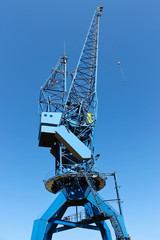 Naklejka premium Shipyard crane against the blue sky
