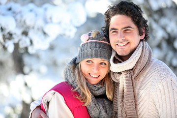 portrait of happy couple at winter resort