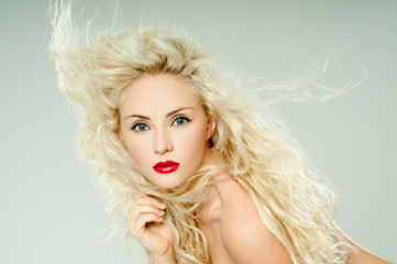 beautiful blonde, heavily madeup red lipstick