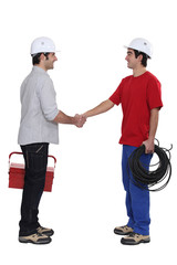 duo of electrician shaking hands